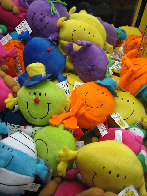 Mr Men swingers club. A bunch of Mr Men toys in a skill tester machine at