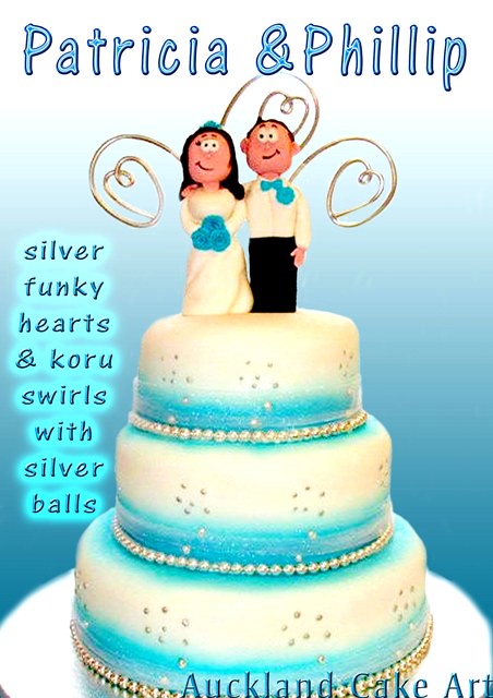SILVER FUNKY KORU SWIRL WEDDING CAKE 3 layers with silver koru shaped 