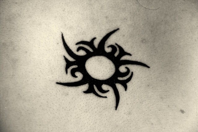 Tribal Sun Tattoo This is my wife's tattoo
