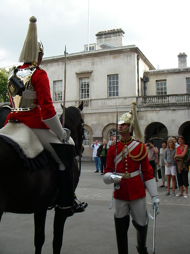 Royal Guard, fancy dress uniform, and swords, on horseback and standing, London, England, UK by Wonderlane