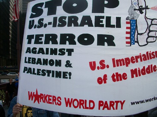 One of the many banners in the Chicago antiwar demonstration that was held downtown on October 16, 2010. Over 1,000 people participated in the demonstration commemorating the 9th anniversary of the Afghan war. (Photo: Abayomi Azikiwe) by Pan-African News Wire File Photos