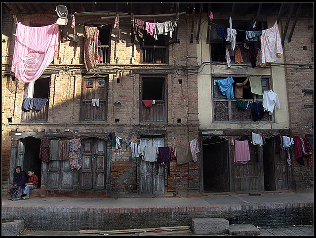 Clothes, Doors, windows, few families and.... One Rusty Building