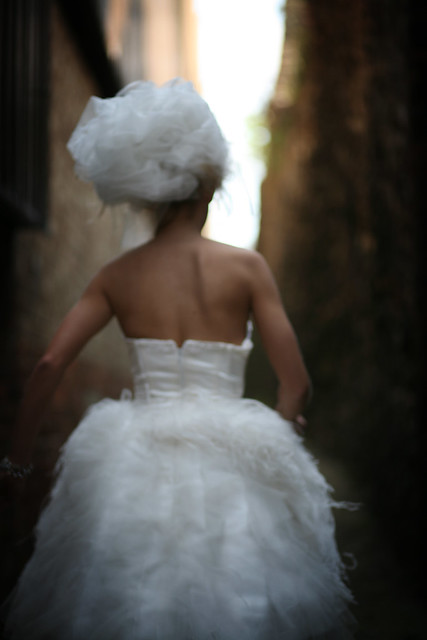 Short satin and ostrich feather wedding dress rear