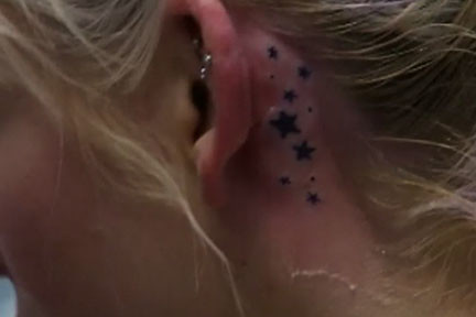tattoos of stars behind the ear. tami's tattoo. This is a still from when I was on Split Ends.