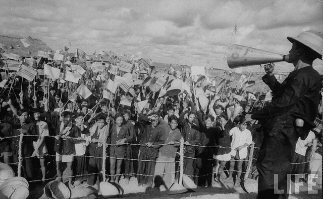 1956 - Crowds cheering Ngo Dinh Diem along route, during visit.