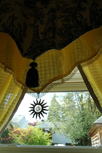 Toile drapes with sun crystal, and blue and cream border, handmade yellow curtains, kitchen, Seattle, Washington by Wonderlane
