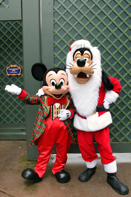 Mickey Mouse and Goofy dressed up for Christmas