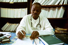 A doctor looks over a patients medical records