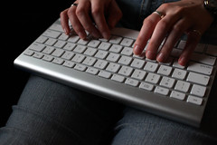 woman's fingers on a keyboard
