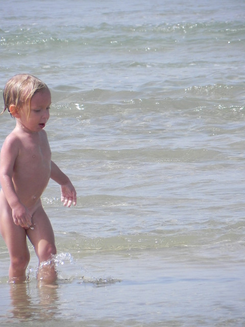 Naked kid in sea