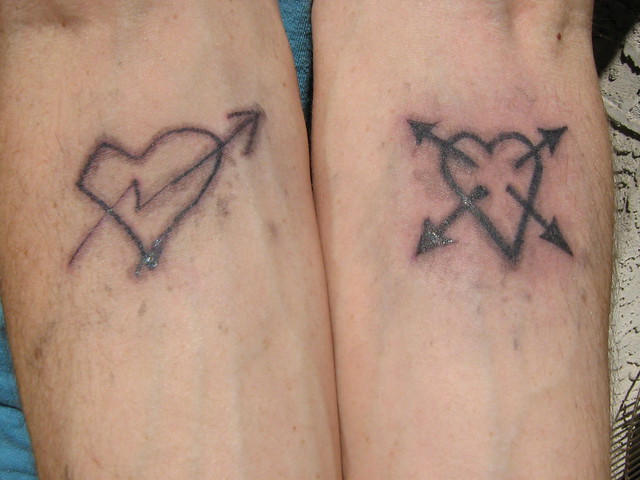both arm tattoos