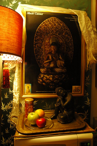 Buddha poster and sculpture with fruits, shrine on top of a microwave, Greenwood, Seattle, Washington, USA by Wonderlane