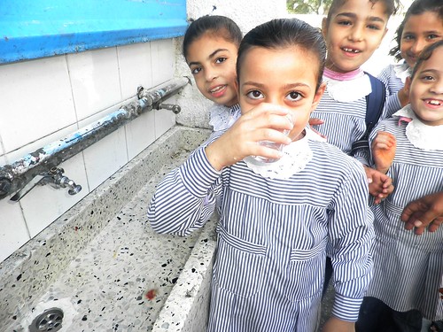 Girl Drinking Clean, Safe Water at Bureij Elementary School