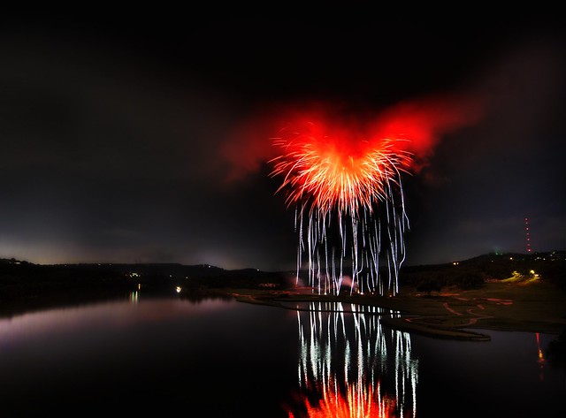 Heart of Satan - What it looks like when fireworks explode inside of a storm cloud over a river