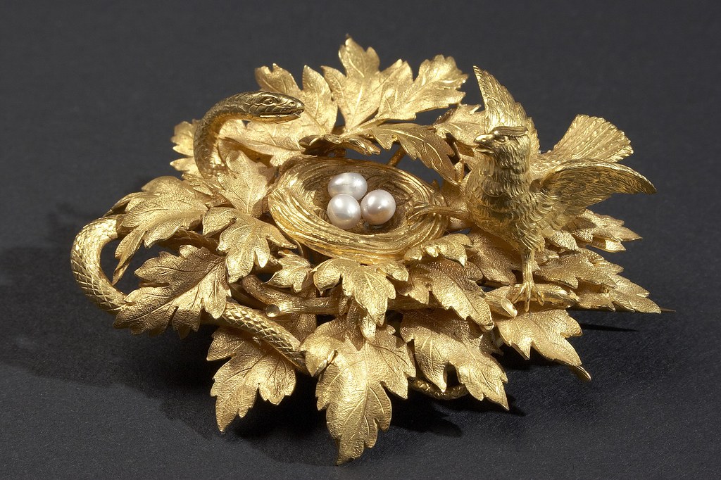 Brooch—gold with pearls, in the form of a bird's nest on a branch with rich foliage of lobed leaves.