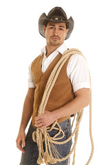 cowboy in vest with rope on shoulder