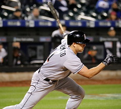 J.T. Realmuto swings at a pitch