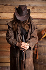 cowboy duster long hair rifle look down wall