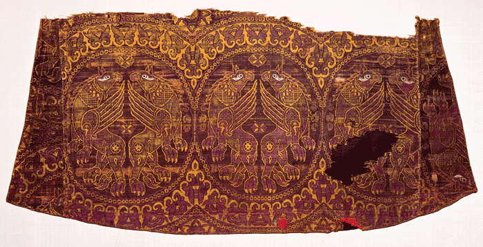 Fragment from an 11th-century Byzantine robe shows griffins embroidered on a delicate silk woven of murex-dyed threads.