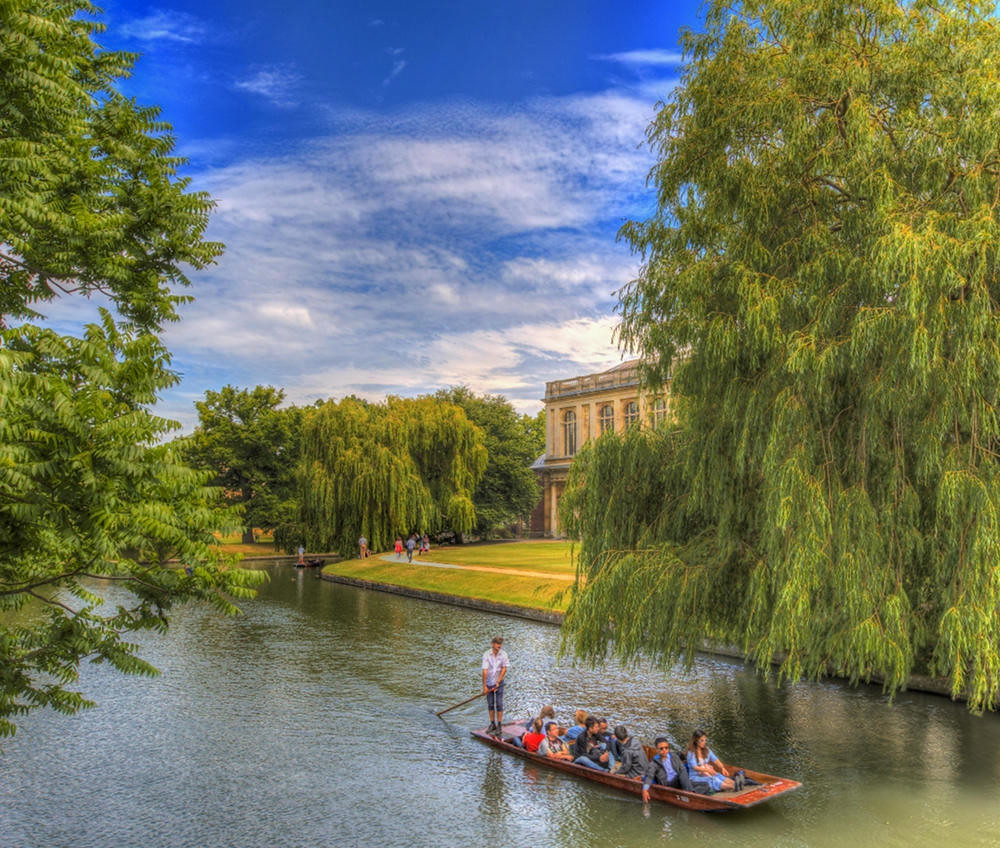 Punting past Trinity College Wren Library, Cambridge. Credit Scudamore’s Punting Cambridge, flickr