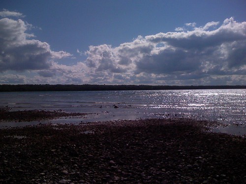 sunlight lake beach water clouds reflections michigan lakeshore lakehuron presqueisle iphone