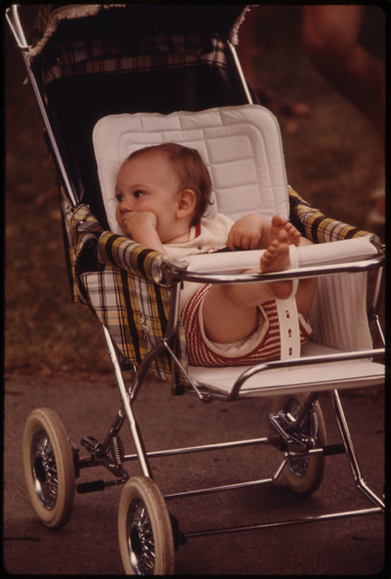 Youngster in a Stroller Awaits His Family in New Ulm Minnesota...
