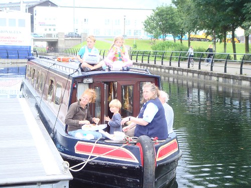 Family on the barge enjoying their Fish n' Chips