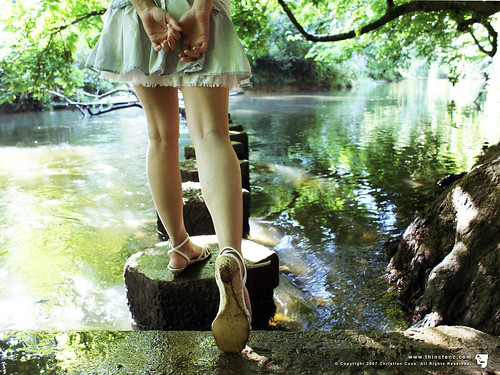 woman cute water girl shirt female fairytale river ruffles back hands stream pretty crossing legs tales stones alice sandals feminine bank mini skirt fairy stepping innocence denim behind delicate playful tale petite hayley whimsical fairytales dainty strappy clasped