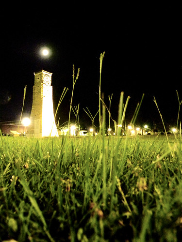 moon green tower clock grass stone night dark lights university time capsule arkansas monticello uam