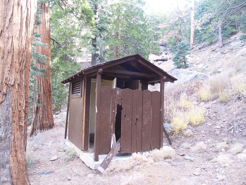 Vandal-damaged outhouse