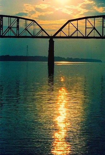 railroad trestle bridge sunset water