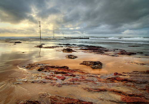 red sky seascape storm beach landscape rocks gloomy dramatic monavalebeach auselite