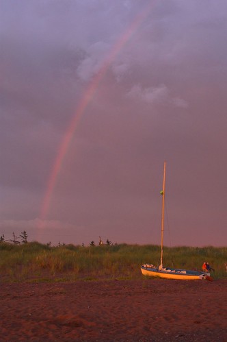 sunset storm beach grass clouds sailboat boat rainbow pei