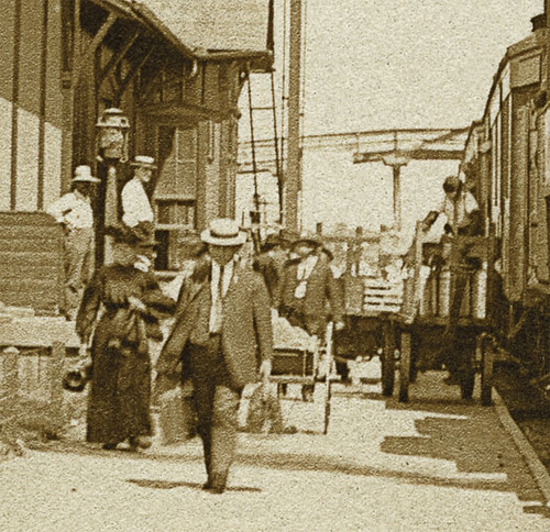 horses people woman usa man men history station sepia buildings walking clothing dock women workmen hats indiana trains transportation depot hotels businesses railroads albion wagons realphoto hoosierrecollections