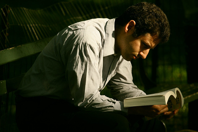 candid photo of man reading