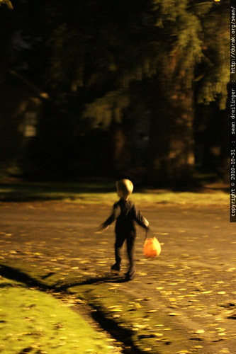 trick or treater running down the street
