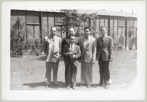 Five men pose