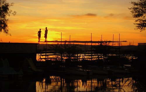 sunset orange lake black yellow austria boat