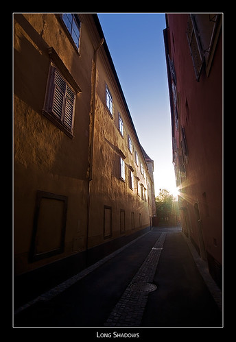 street houses sunset shadows walls