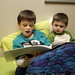 nick reading his little brother a story to cheer him up
