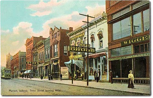 people woman usa signs man color men history buildings walking advertising awning women shoes indiana streetscene marion transportation drugs shops pedestrians storefronts theaters dentist clocks businesses theatres streetcars grantcounty hoosierrecollections