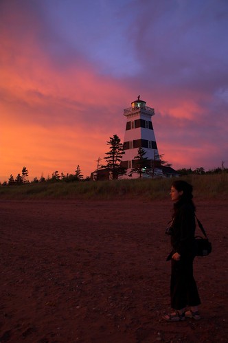 sunset sky people orange woman lighthouse beach girl beautiful clouds person diana pei