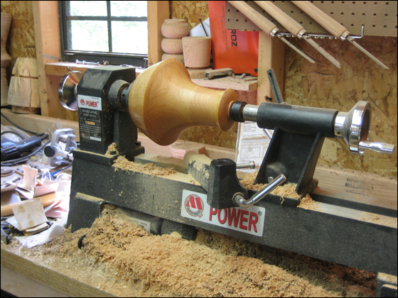 Turned wooden piece on lathe