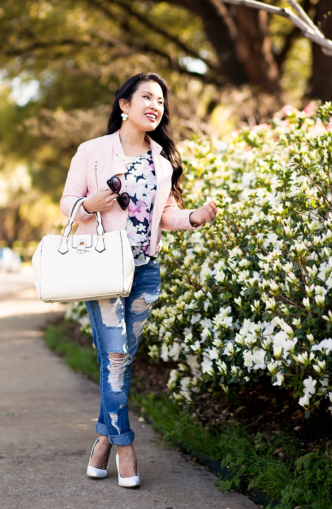 cute & little blog | petite fashion | pink blush moto jacket, floral tiered blouse, akira distressed jeans, white pumps | spring outfit