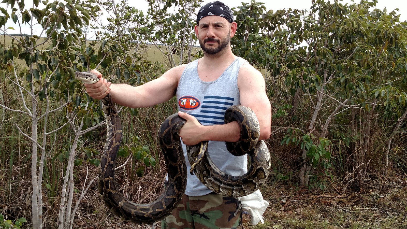 David Steen posing with a captured python