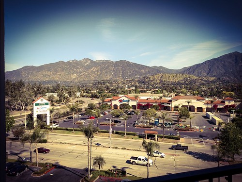 landscape urban city mountains sangabriel california monrovia outdoor mountainside road street ountain hill zajdowicz photoshop cellphone motorola droid turbo android smartphone cameraphone photoborder vignette building architecture roof trees palms automobiles cars sign letters words mountain foothill