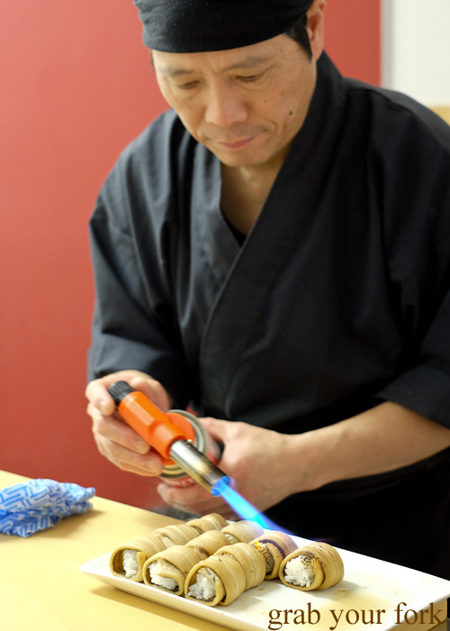 Chef Shinji Matsui blowtorching anago eel sushi at Sashimi Shinsengumi, Crows Nest