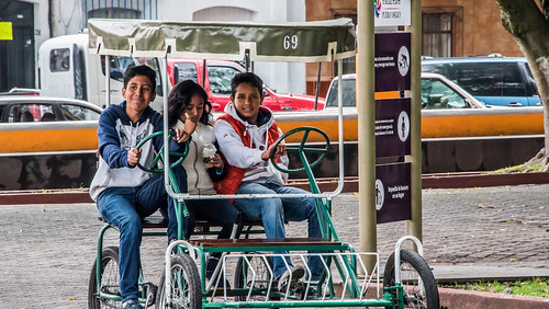 people smile smiling bicycle sign youth umbrella mexico hoodie driving sitting eating candid wheels spoon streetscene chain seats denim cropped pedals trio 69 seating canopy vignetting seated pedalling orizaba 2016 pueblomágico chaindrive denimjeans orizabaveracruz tedmcgrath tedsphotos peopleandpaths magictownsofmexico tedsphotosmexico bicyclebultforthree