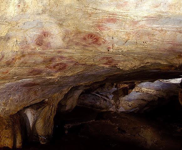 hand stencils in El Castillo Cave. Gabinete de Prensa del Gobierno de Cantabria, Wikimedia Commons