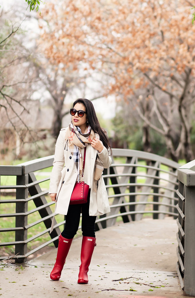 cute & little blog | petite fashion | classic double-breasted trench, burberry check summer scarf, black jeans, red hunter rain boots, red studded crossbody bag | rainy day spring outfit